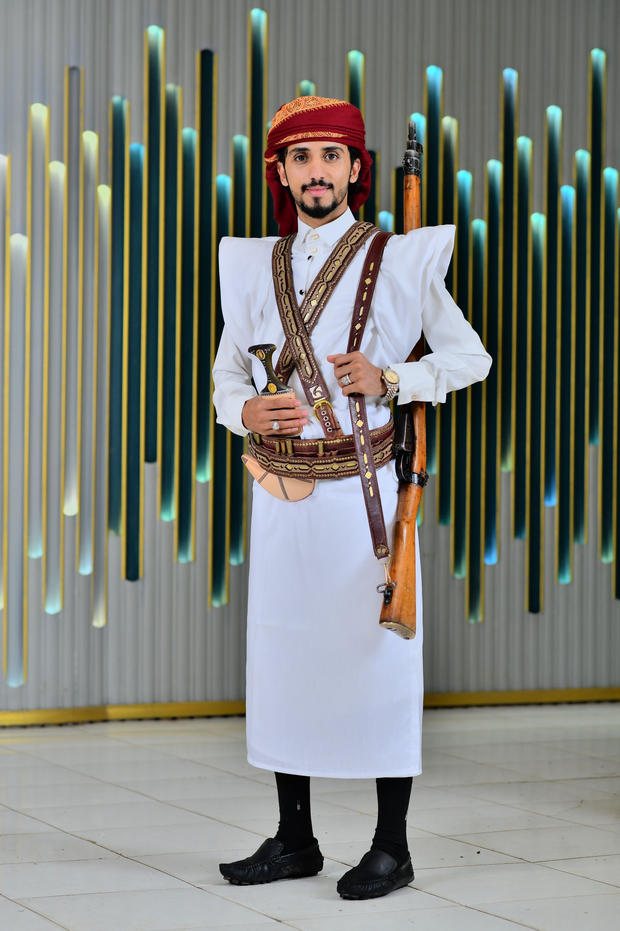 Traditional Yemeni Attire with Jambiya and Rifle · Free Stock Photo