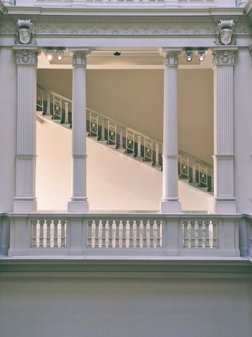 Free Neoclassical columns and staircase in an indoor İstanbul setting, emphasizing elegance. Stock Photo