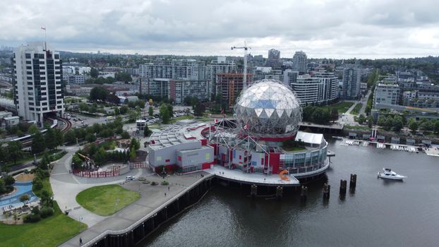 Aerial photo of Science World in Vancouver, showing urban skyline and waterfront.