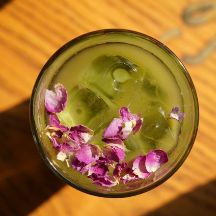 Iced matcha topped with rose petals — photo by Swarup Sarkar on Pexels