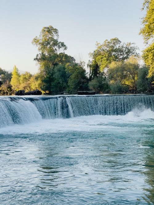 Free Breathtaking view of Manavgat Waterfall surrounded by lush greenery in Antalya, Türkiye. Stock Photo