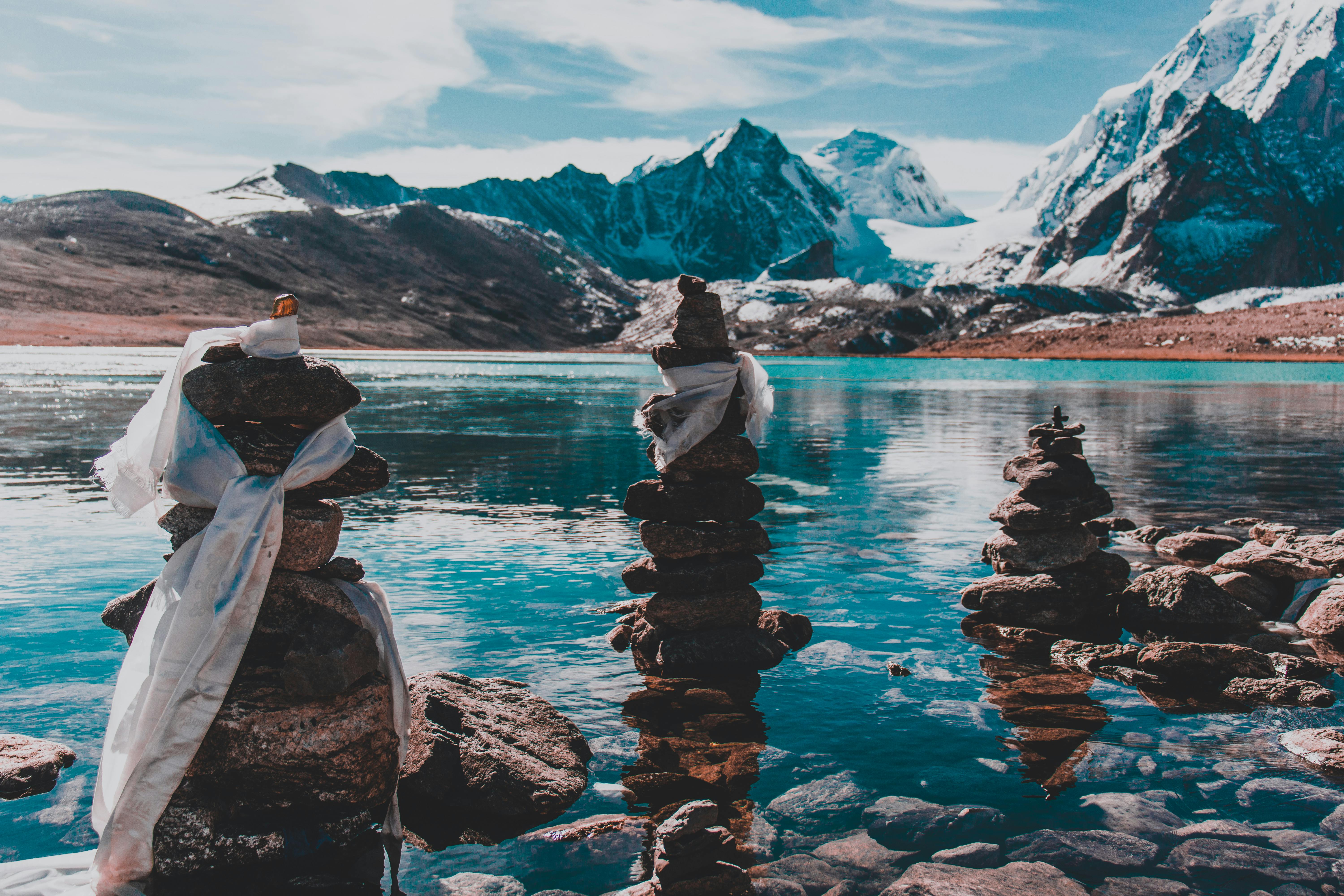 stack of stones in body of water