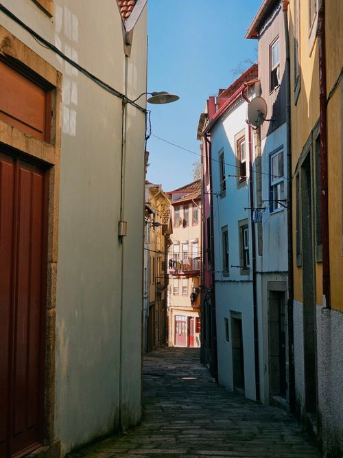 Free Explore the charming narrow streets of Porto, full of colorful historic buildings and quiet ambiance. Stock Photo