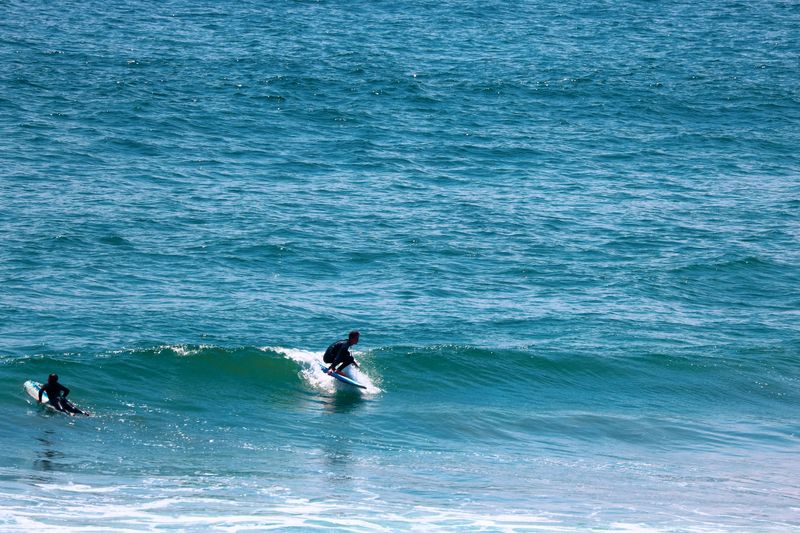 Surfer riding a green wave, captured by a MarySol photographer