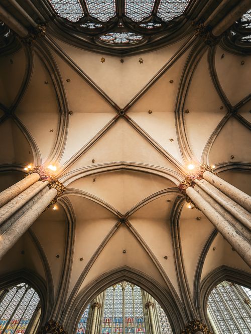 Free Stunning view of a Gothic cathedral ceiling, showcasing intricate architecture. Stock Photo
