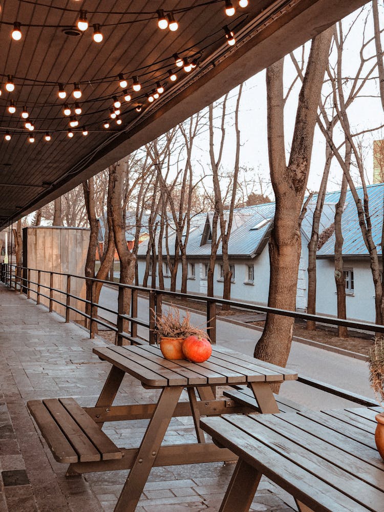 Photo Of Wooden Table Near Handrail