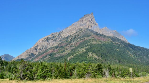 Explore the stunning natural beauty of Waterton Lakes National Park with this majestic mountain view.