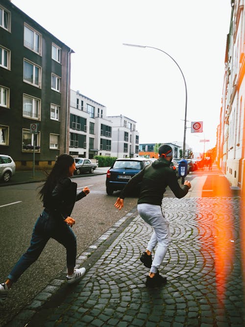 Man and Woman Running Outdoors