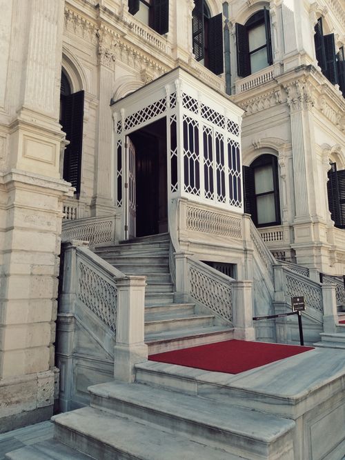 Free Elegant entrance of a historic marble building in Istanbul, Türkiye with a red carpet staircase. Stock Photo