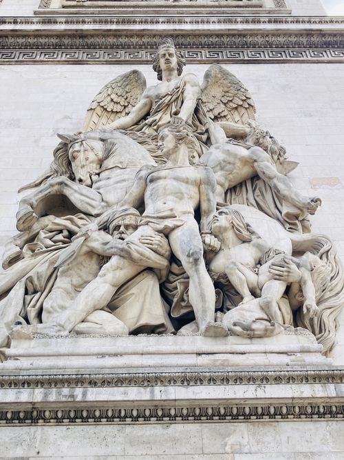 Free Close-up of a detailed stone sculpture on the Arc de Triomphe, Paris. Stock Photo