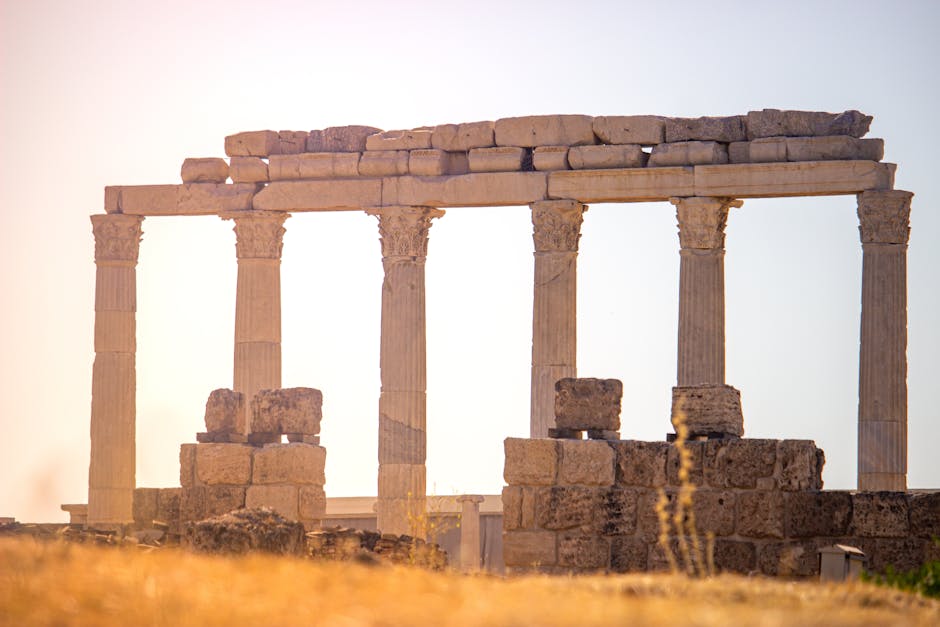 Majestic ancient Greek ruins with columns captured at sunset, exuding historical charm.