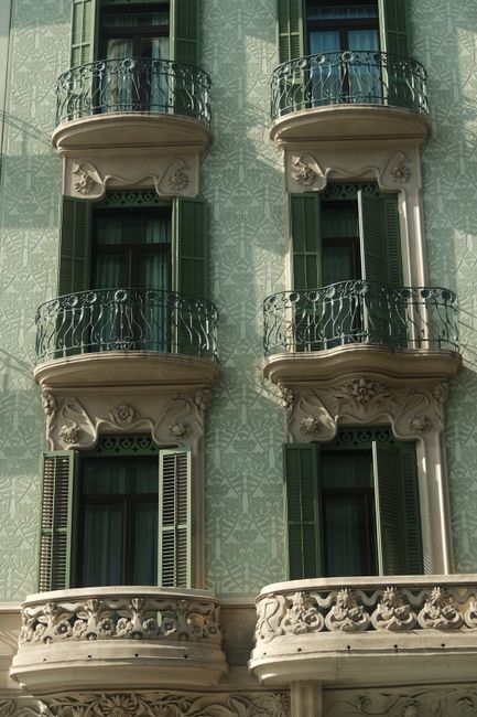 Close-up of an intricate European building's balconies, showcasing classic vintage architecture.