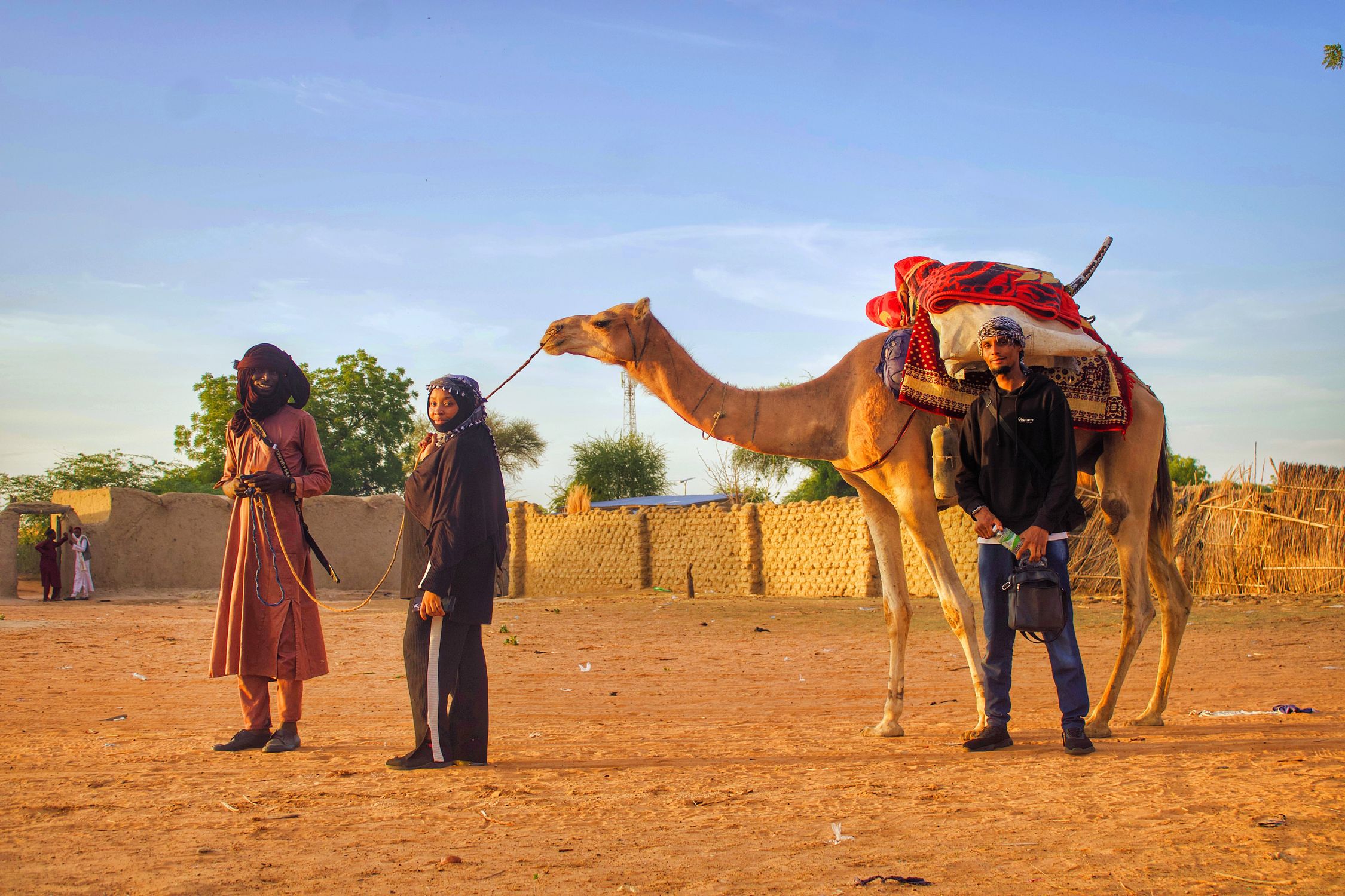 Traditional Camel Riding Camel Riders in Traditional Desert Setting at Sunset · Free Stock Photo