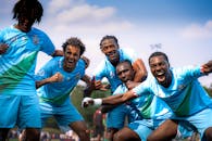 Joyful Soccer Team Celebrating a Victory