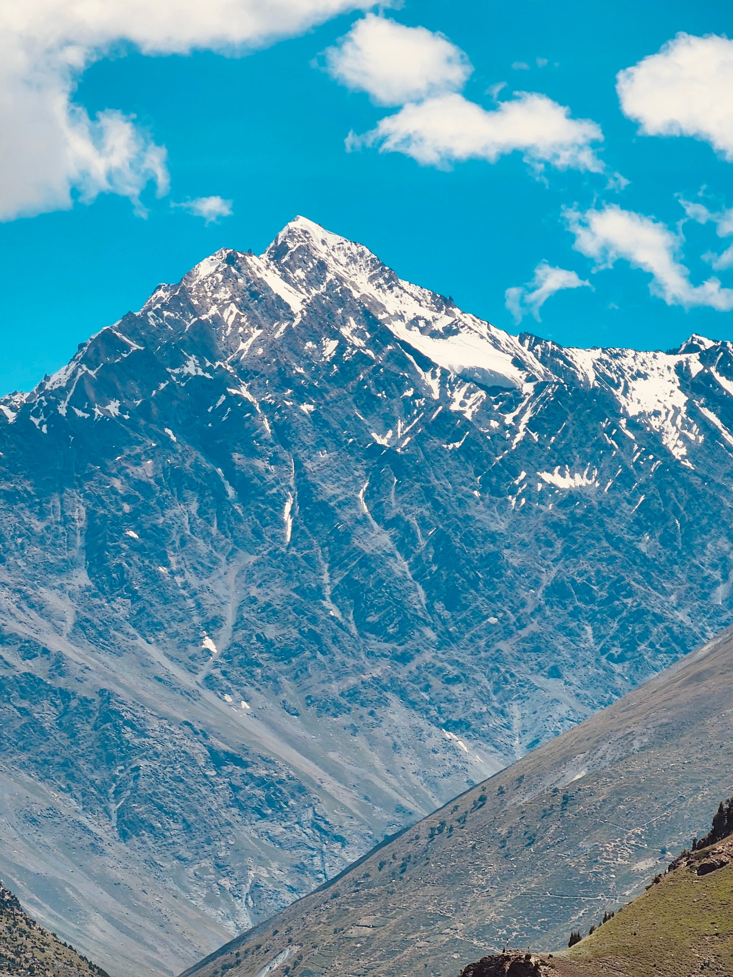 Breathtaking view of a snow-capped Himalayan peak under a clear blue sky.