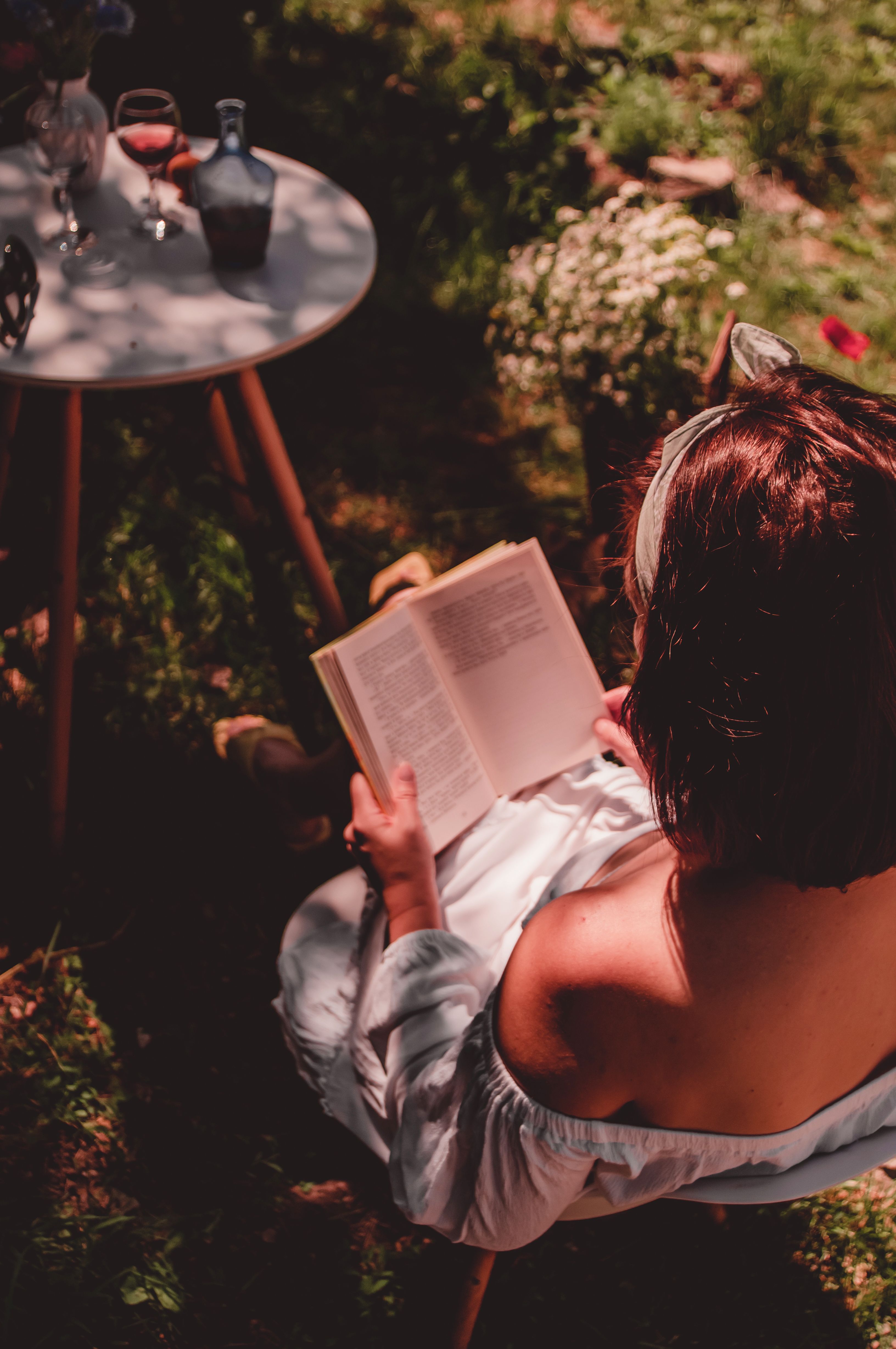Relaxing Summer Reading in a Garden Retreat · Free Stock Photo
