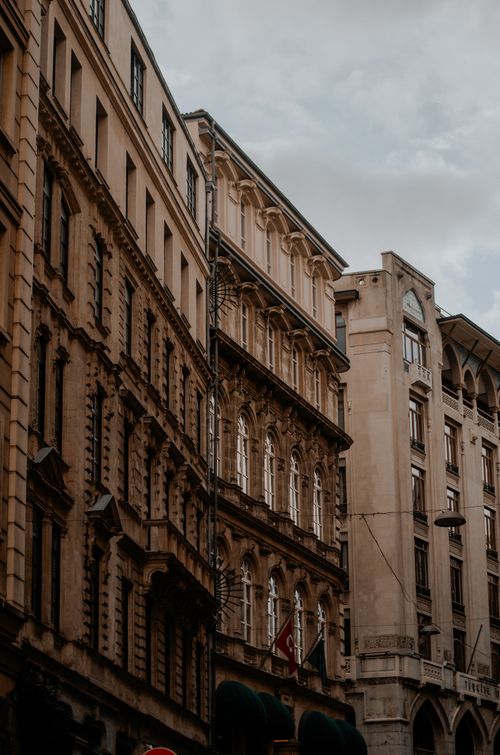 Free A view of ornate historic buildings in a European city, showcasing elegant architectural details. Stock Photo