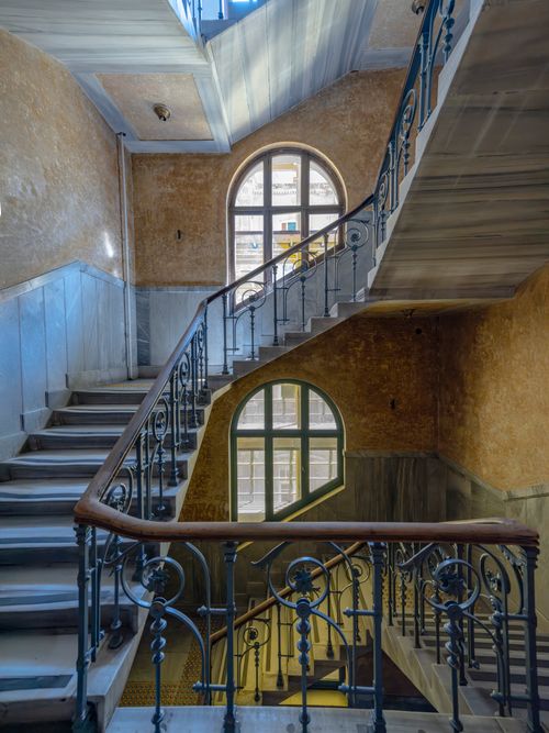 Free Intricate ironwork staircase in a historic İstanbul interior, capturing architectural elegance. Stock Photo