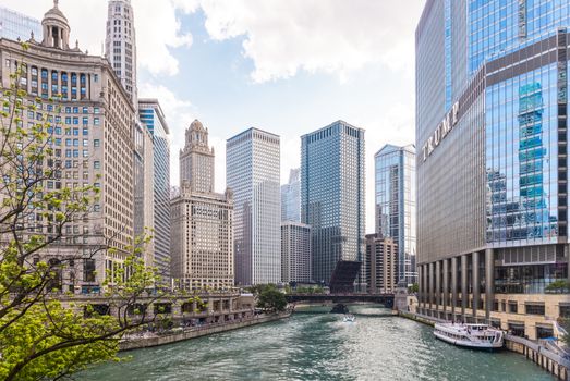 Captivating view of Chicago's iconic skyscrapers along the river on a clear day.