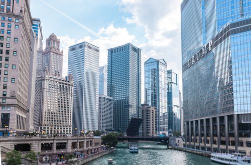 Free Explore the iconic skyline of Chicago with majestic skyscrapers along the Chicago River on a bright day. Stock Photo