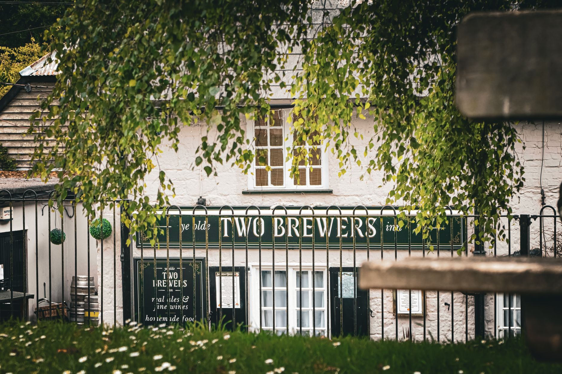 Charming view of Two Brewers pub in rural Shaftesbury, England, showcasing its traditional exterior.