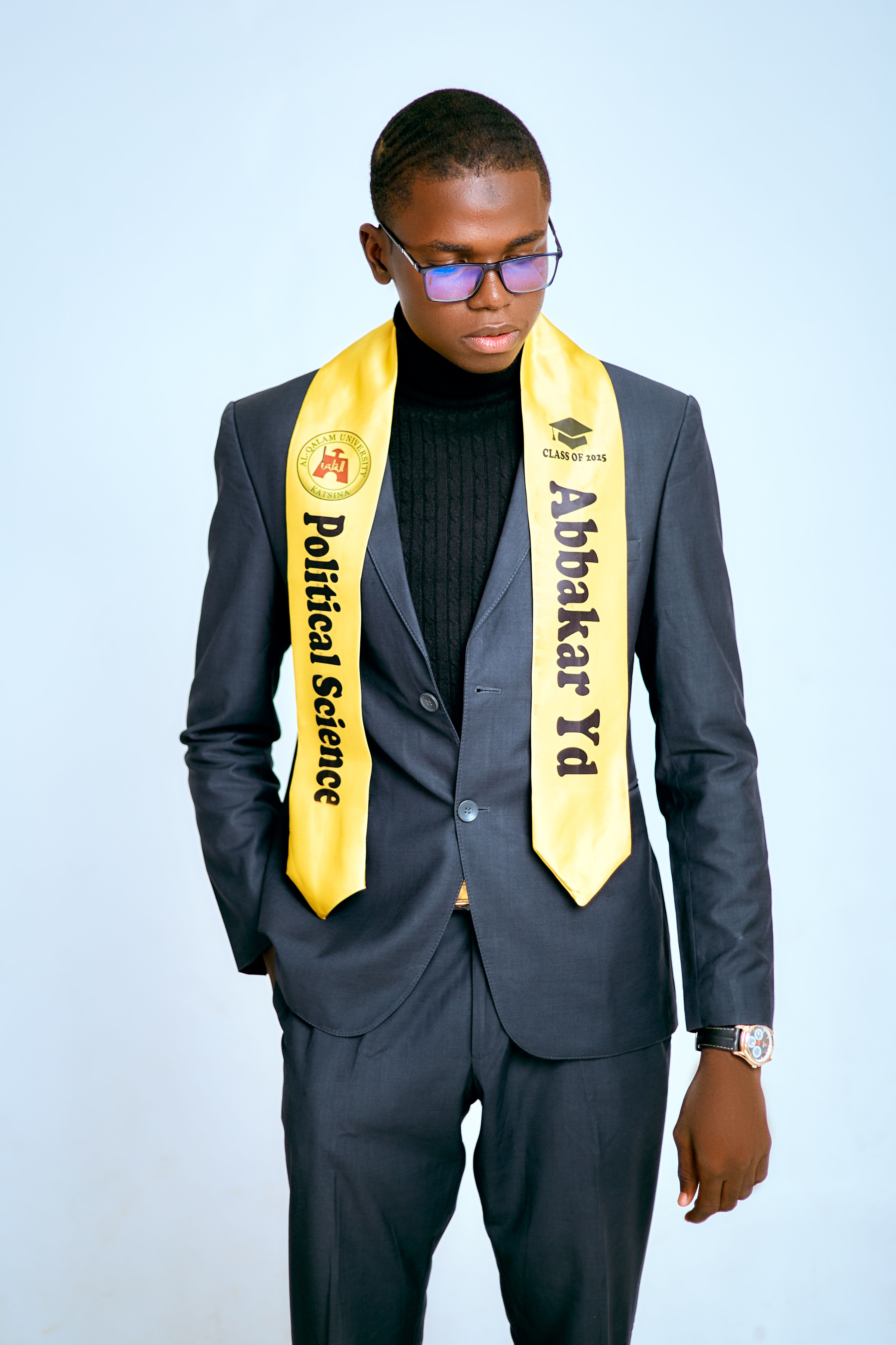 Young Graduate in Suit with Graduation Stole  Free Stock Photo