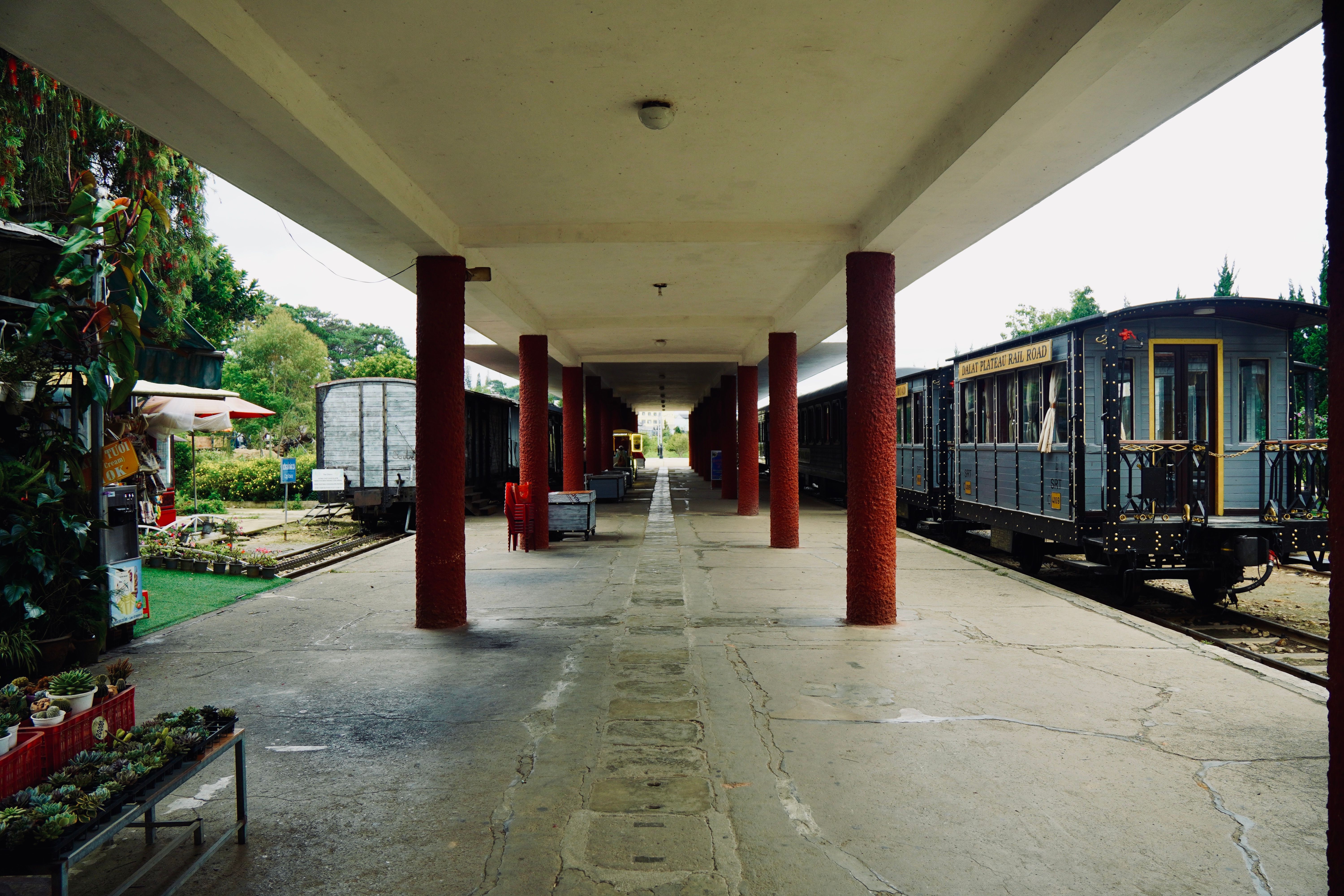 Vintage Train Station Platform with Historic Trains · Free Stock Photo