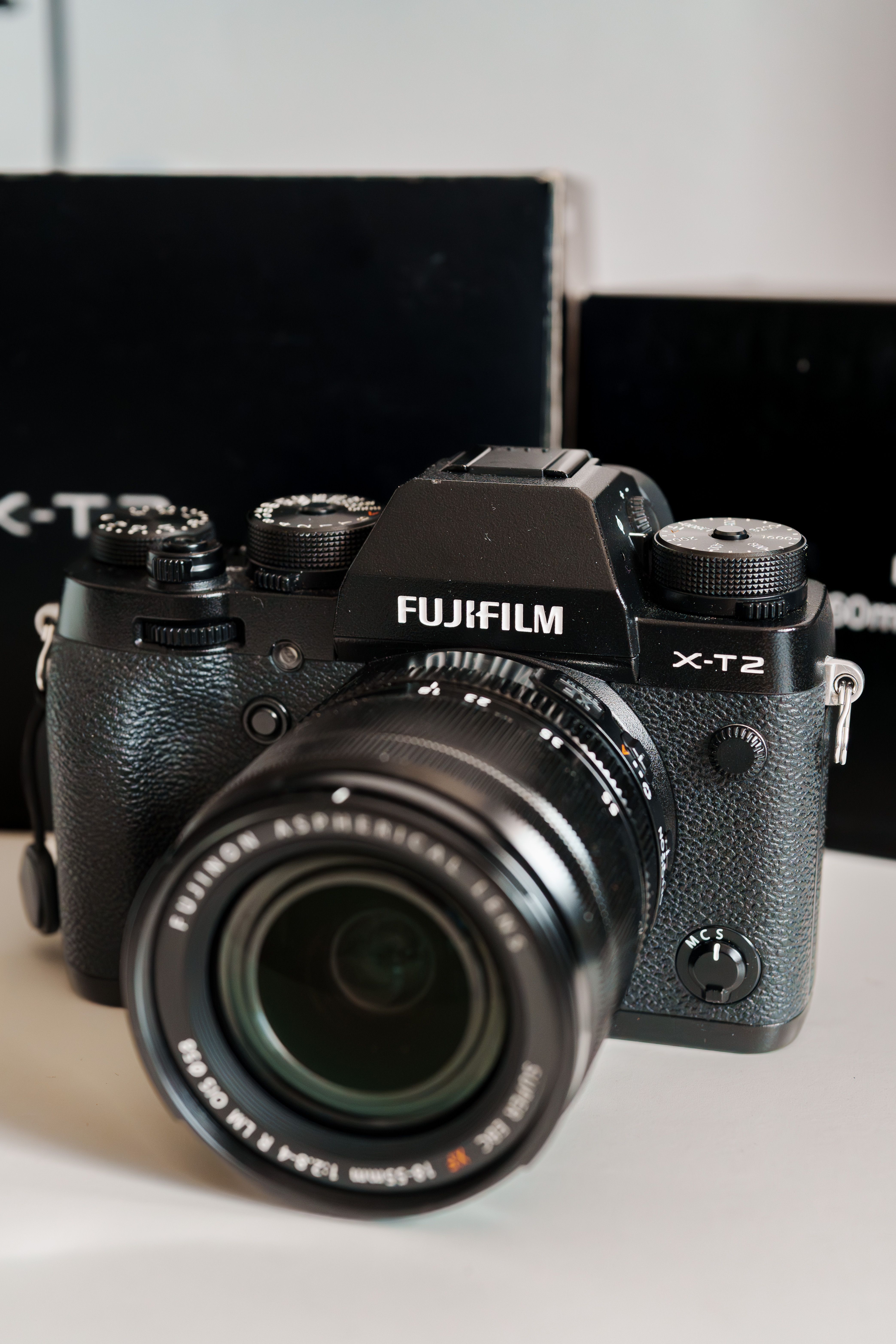 Close-up of Fujifilm X-T2 camera with attached lens, perfect for photographers.
