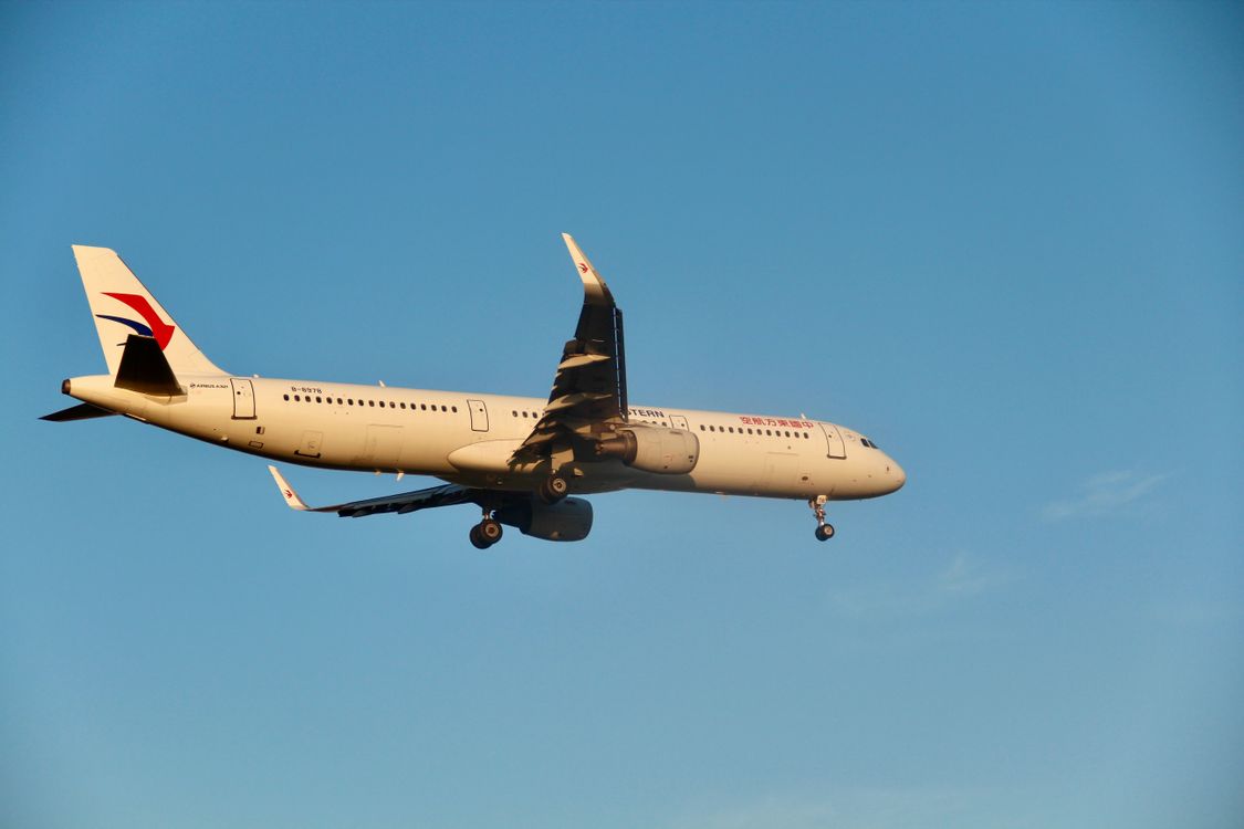With Flight Commercial Airplane in Flight Against Clear Sky · Free Stock Photo