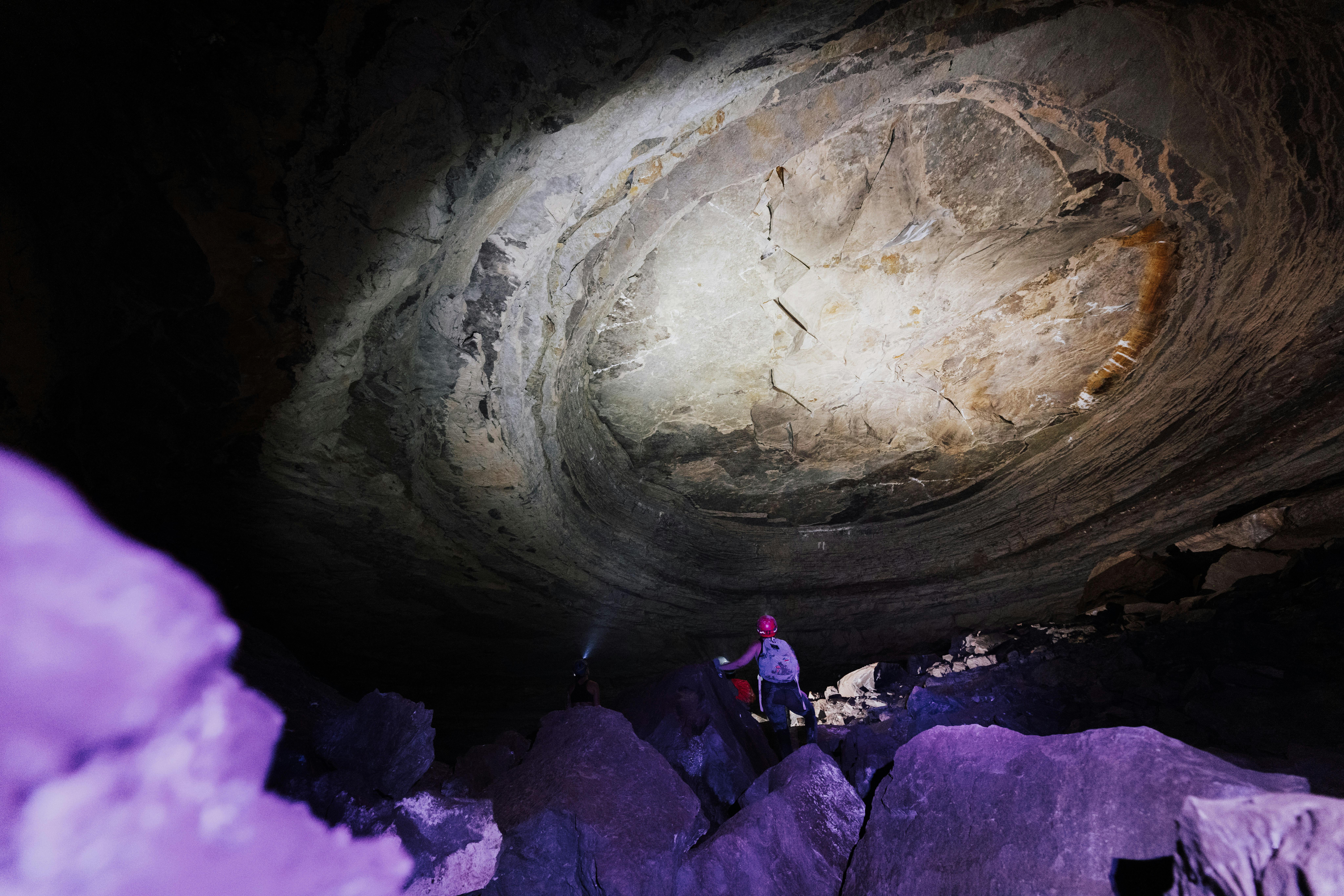 Explore the majestic underground world with a team on an exciting cave expedition.