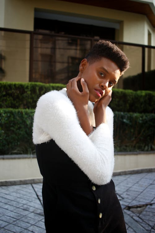 Woman in White Sweater and Black Skirt