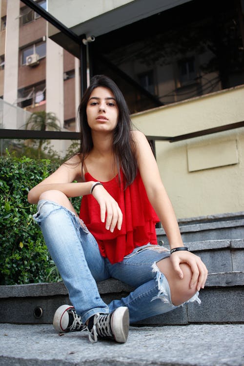 Woman Wearing Red Top and Jeans