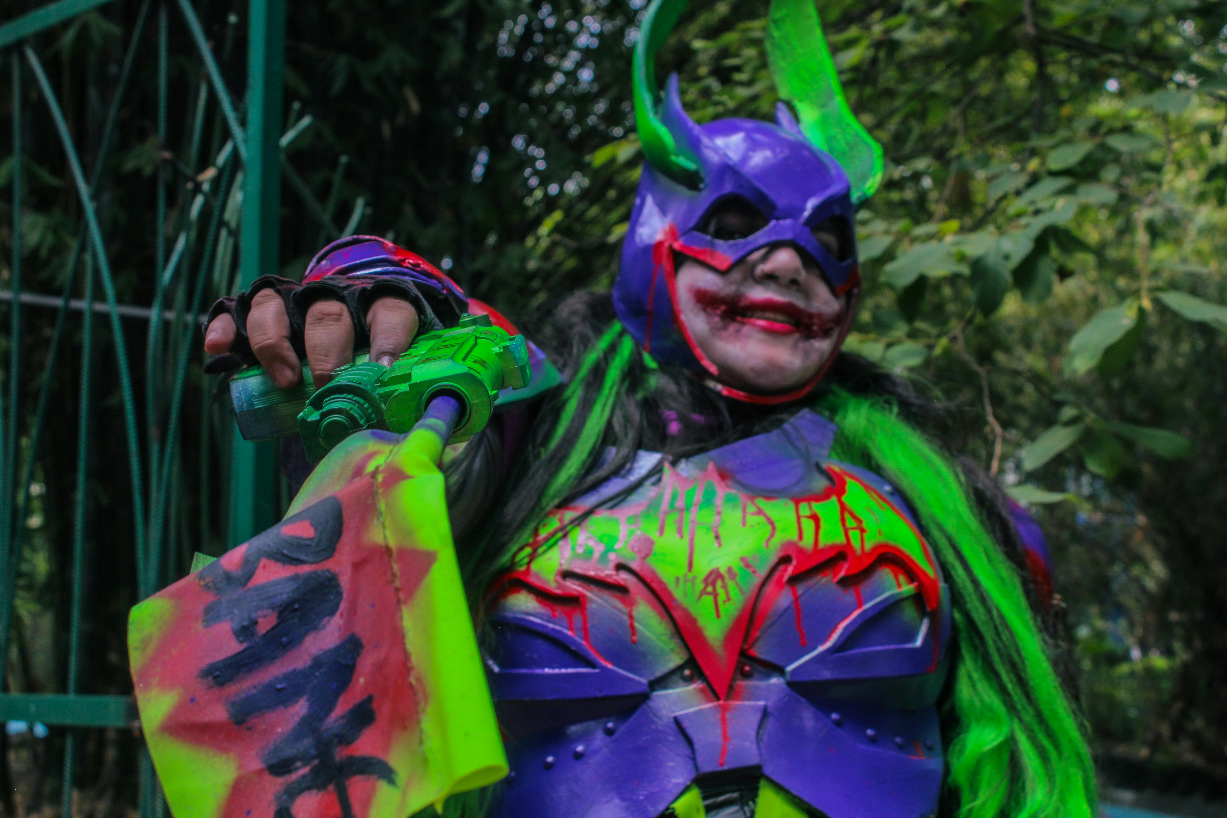Colorful cosplay character with vibrant costume and makeup in Ciudad de México.
