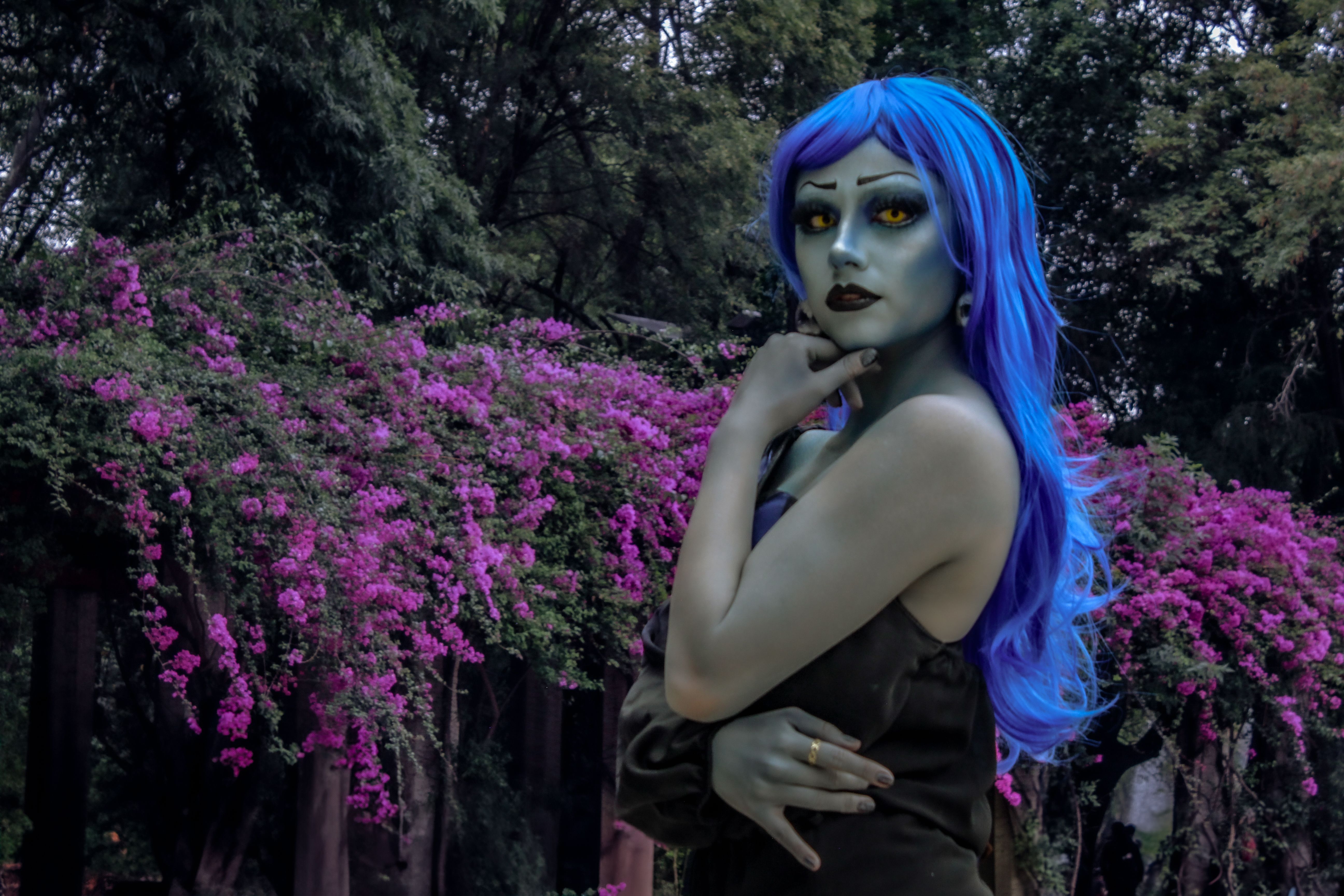 Vibrant Fantasy Cosplay in Urban Garden Setting · Free Stock Photo