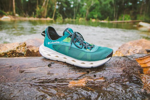 A single Columbia shoe by a river in Đà Lạt, perfect for outdoor and adventure themes.