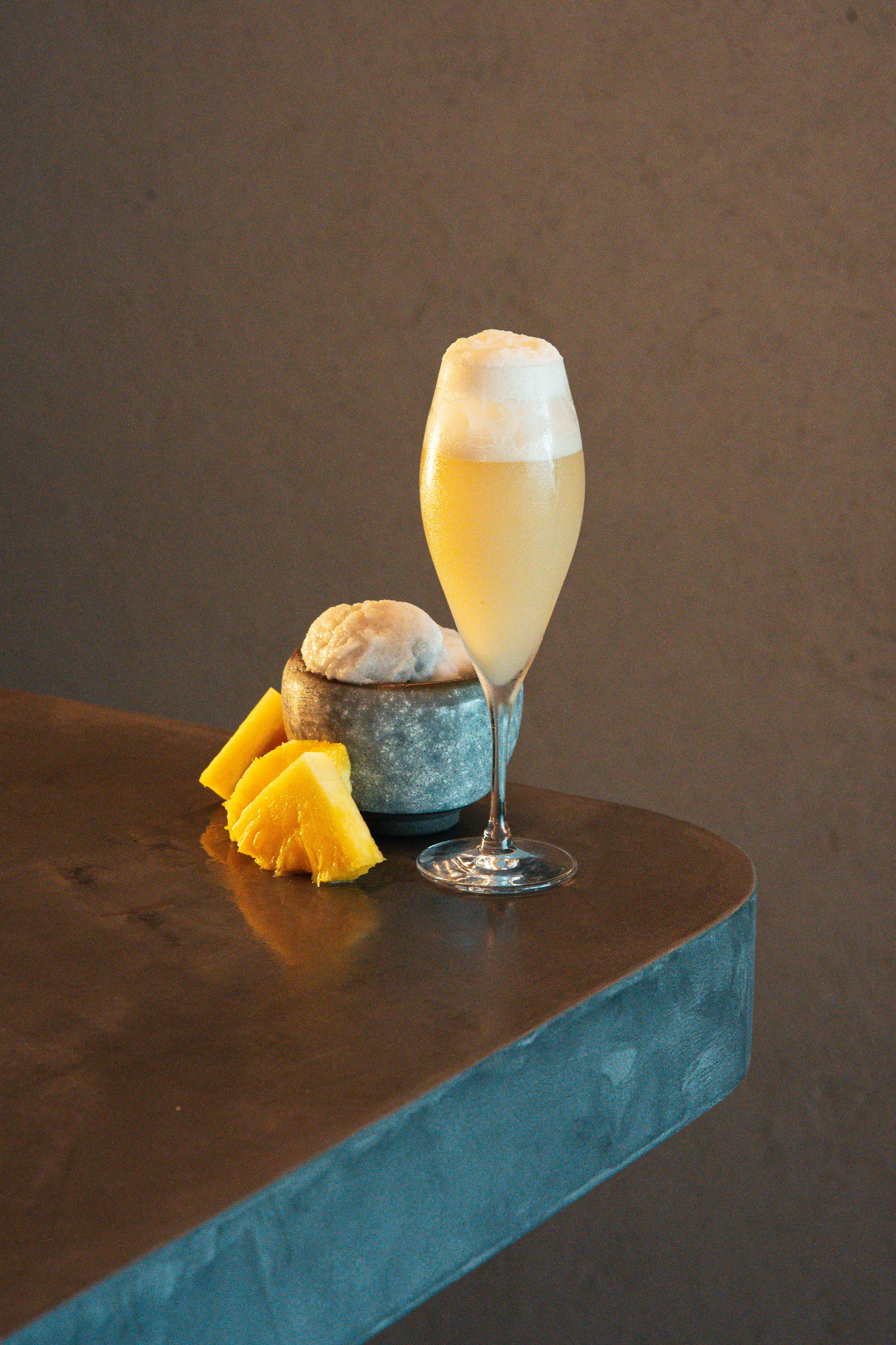 Chic pineapple mocktail with ice cream served in a tall glass, Tokyo vibes.