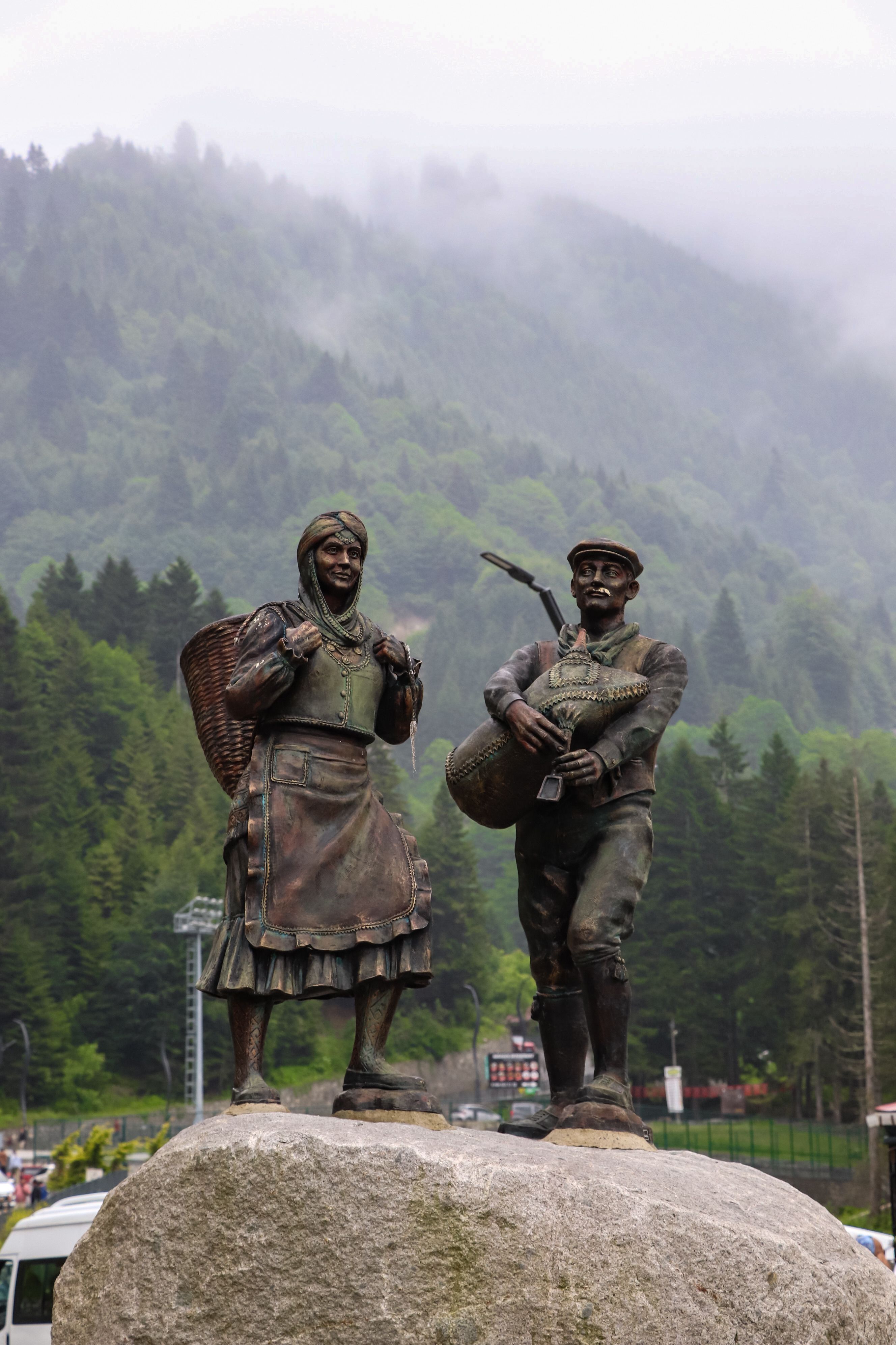 Cultural Statues in Misty Mountain Landscape · Free Stock Photo
