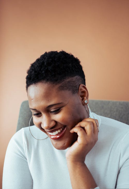 Woman Sitting on a Sofa Chair