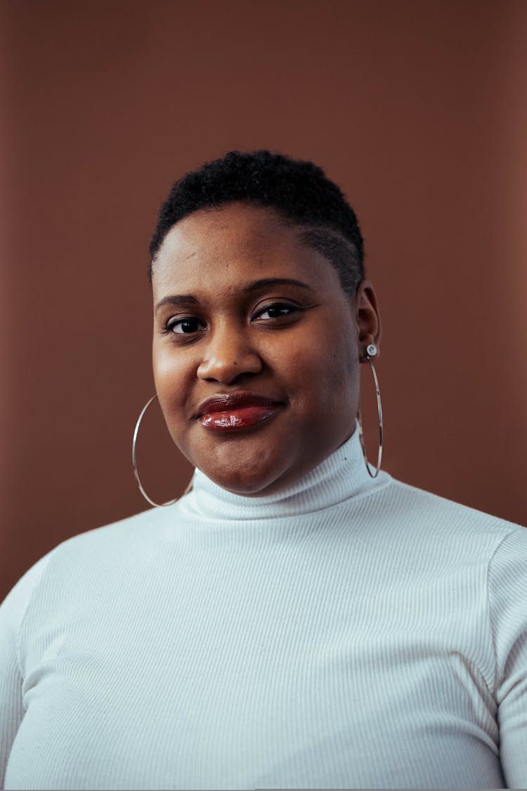 Smiling Woman Wearing White Turtleneck Top