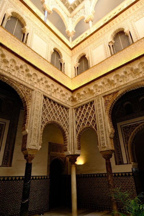 Free Explore stunning Moorish architectural details within the historic Alcazar, showcasing exquisite craftsmanship. Stock Photo