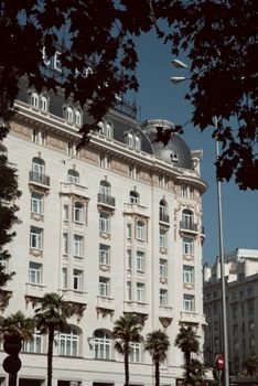 A majestic European-style building in Madrid showcasing classic architecture under a clear blue sky.