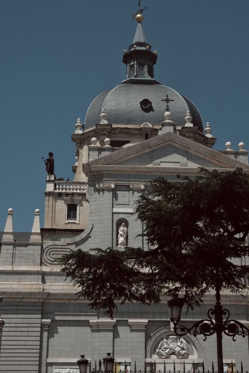 Free Captured view of Almudena Cathedral's impressive dome and facade in Madrid under clear skies. Stock Photo