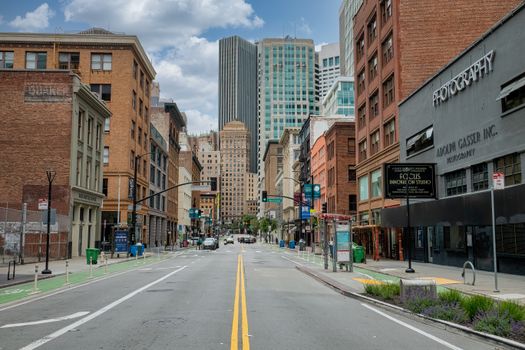 A clear day in downtown San Francisco showcasing urban architecture and empty streets.