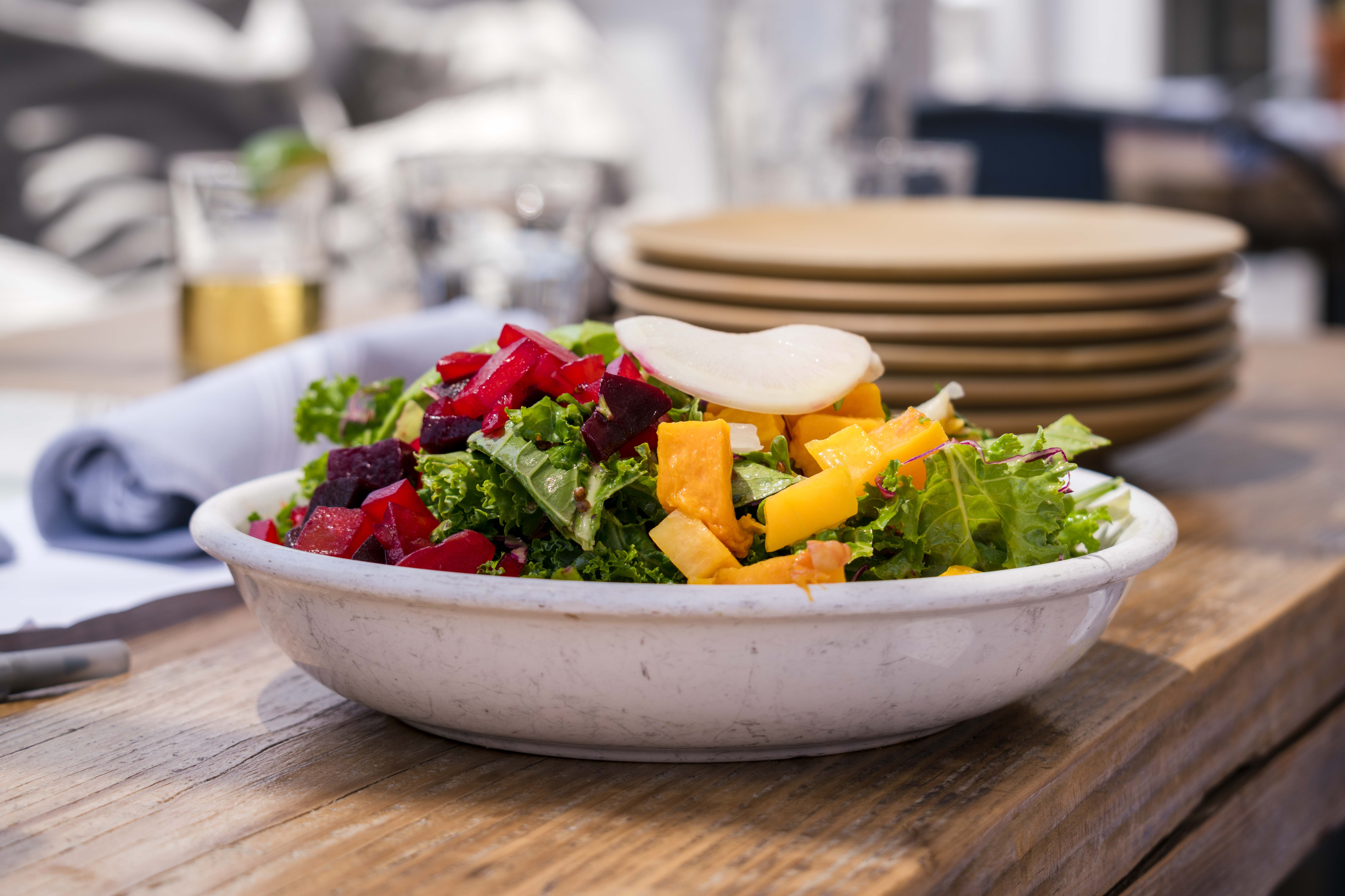 Colorful organic salad featuring fresh vegetables, perfect for healthy living and dining.