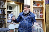 Elderly Artisan with Traditional Azerbaijani Pottery