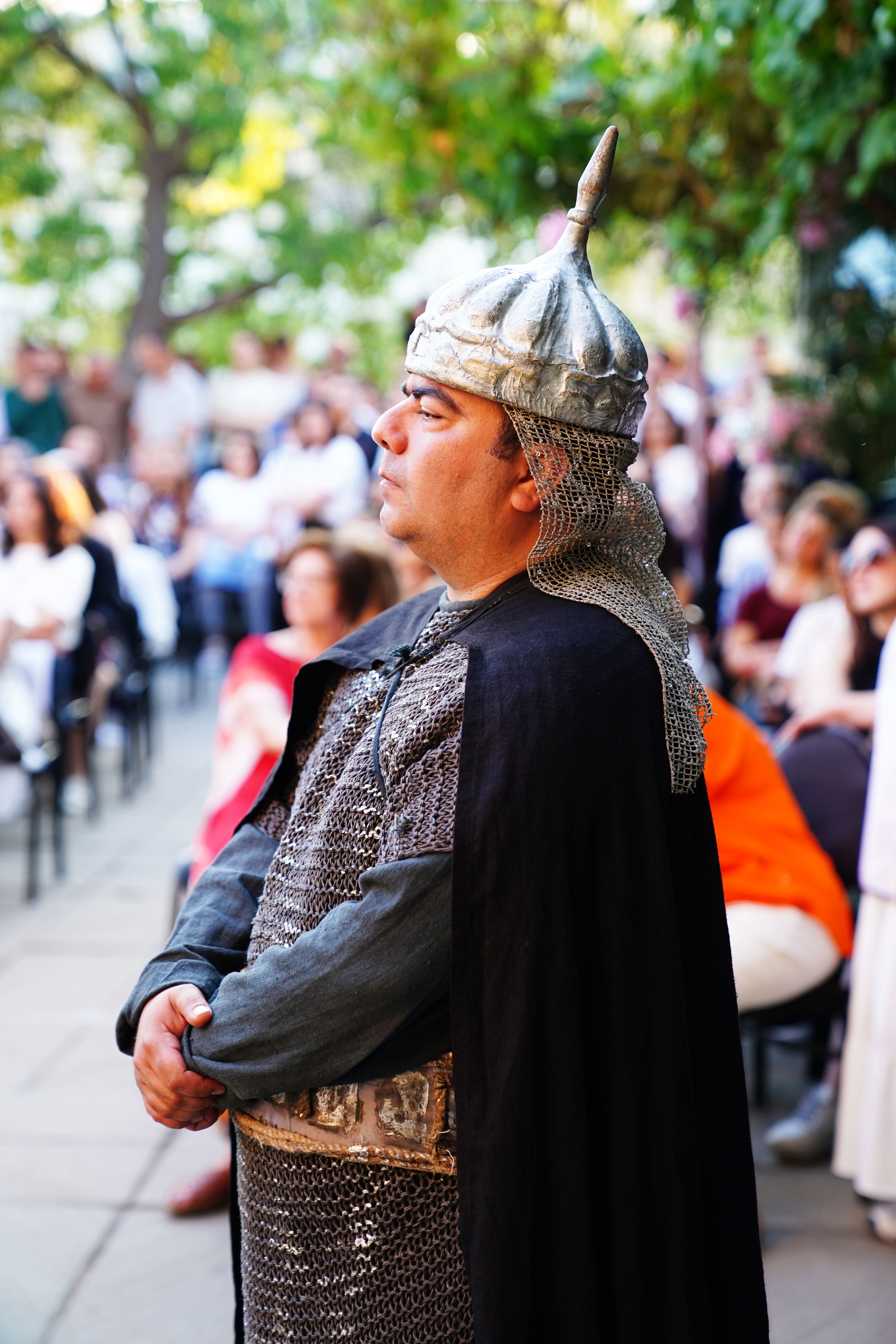A man in medieval armor attends an outdoor event in Baku, Azerbaijan.