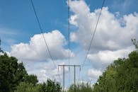 Power Lines Under Cloudy Blue Sky in UK