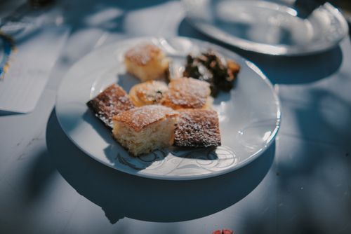 Free Close-up of cake pieces on a plate outdoors with summer sunlight. Stock Photo