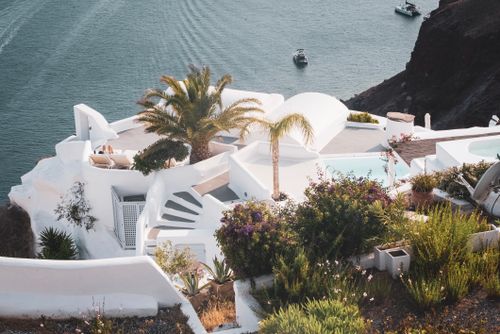 Free White-washed architecture in Fira, Greece, overlooking the serene Aegean Sea on a summer day. Stock Photo