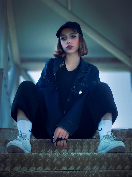 Stylish Young Woman in Urban Setting · Free Stock Photo